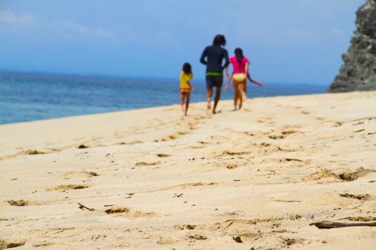A family walking on a beach