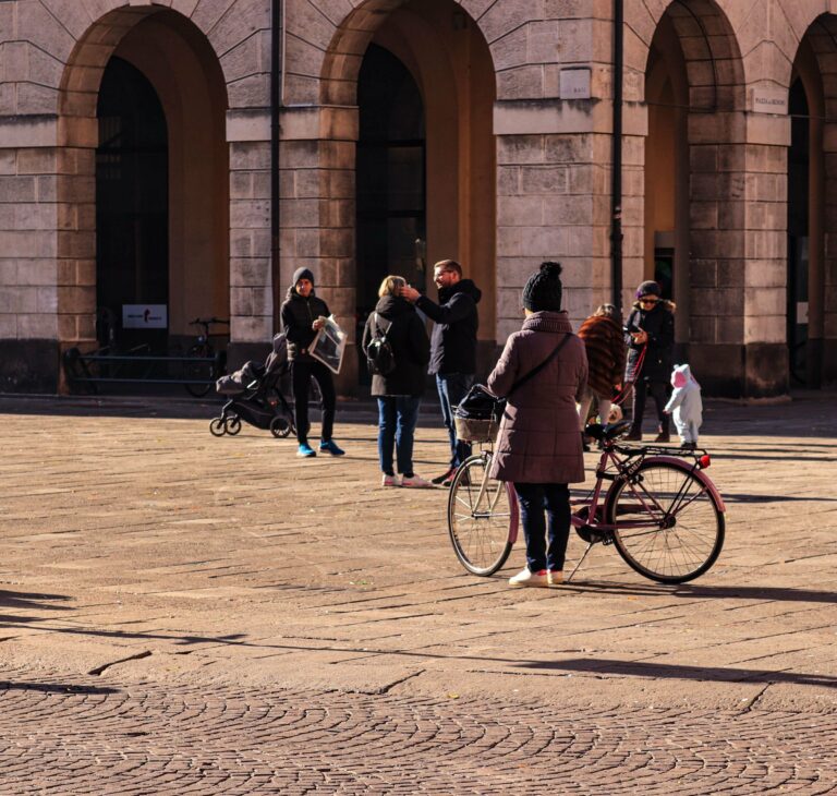 A family in a sunny Italian piazza