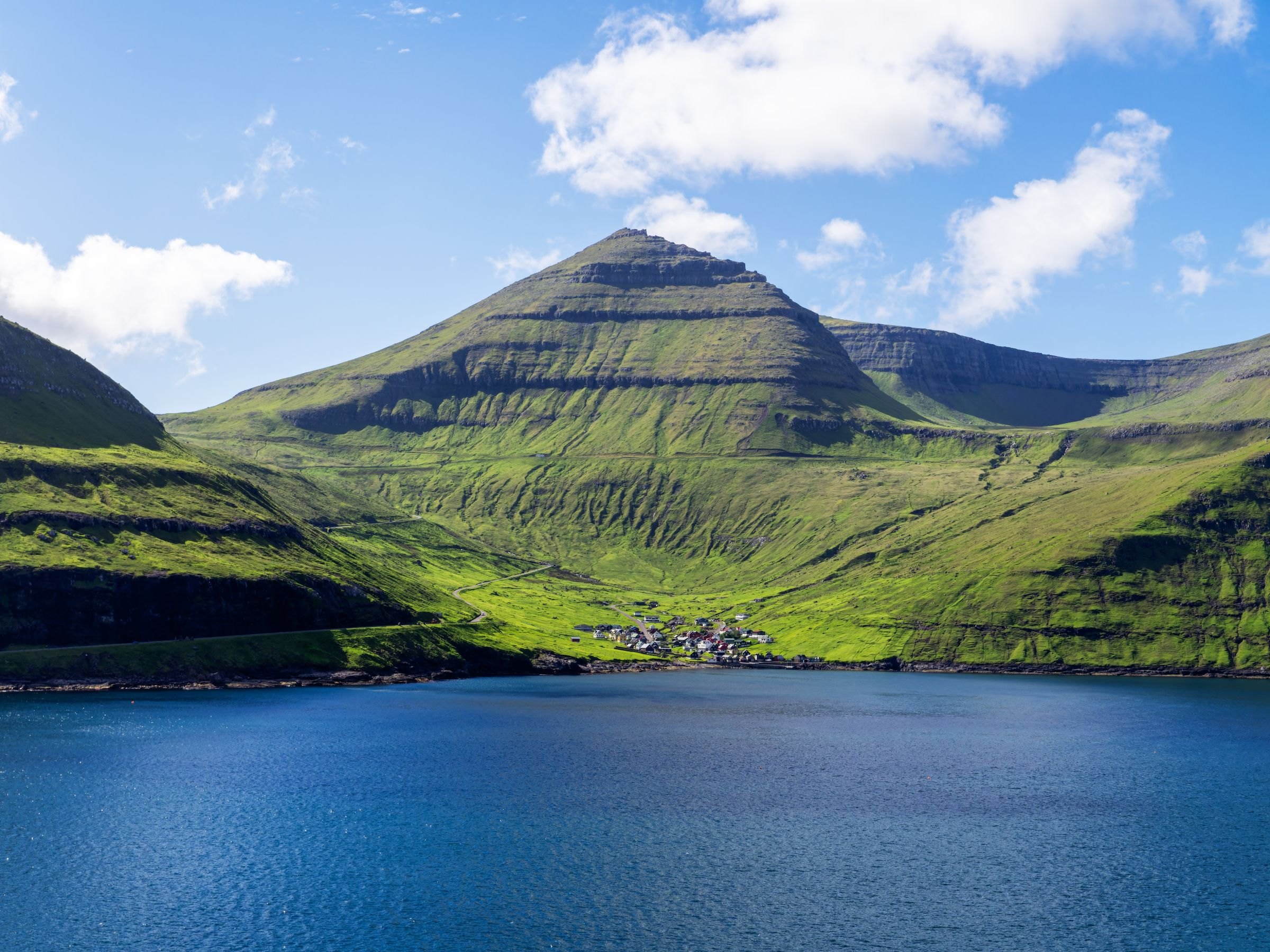Green mountains above a fjord in the Faroe Islands