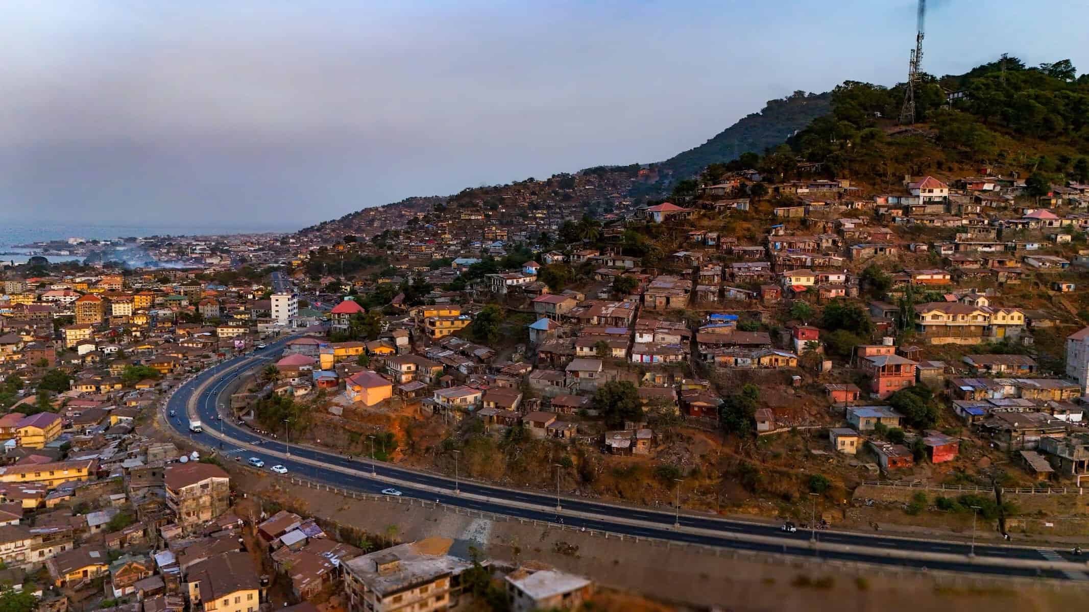 Hillside houses above a road in Freetown