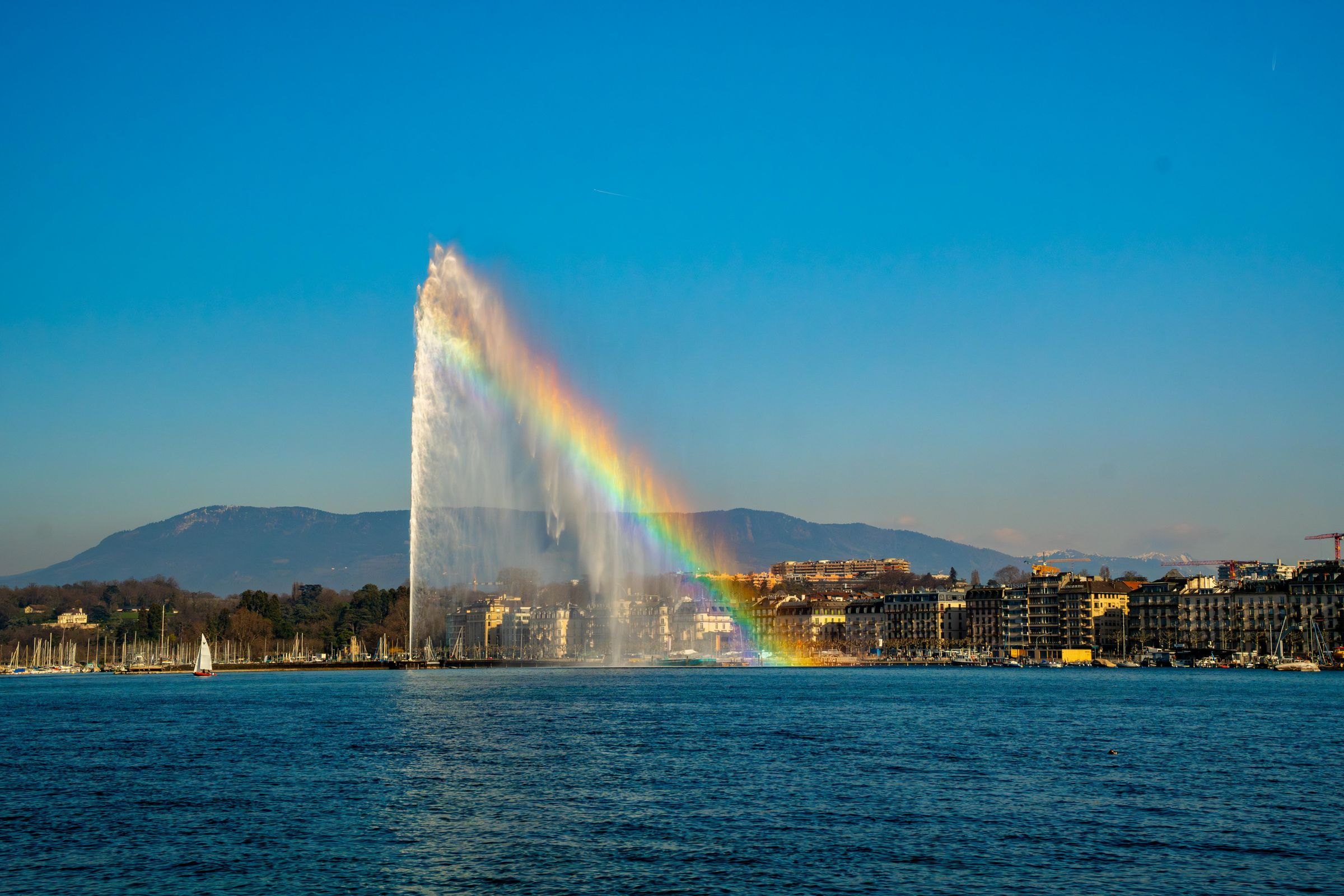 The Jet d'Eau on Lake Geneva with a rainbow