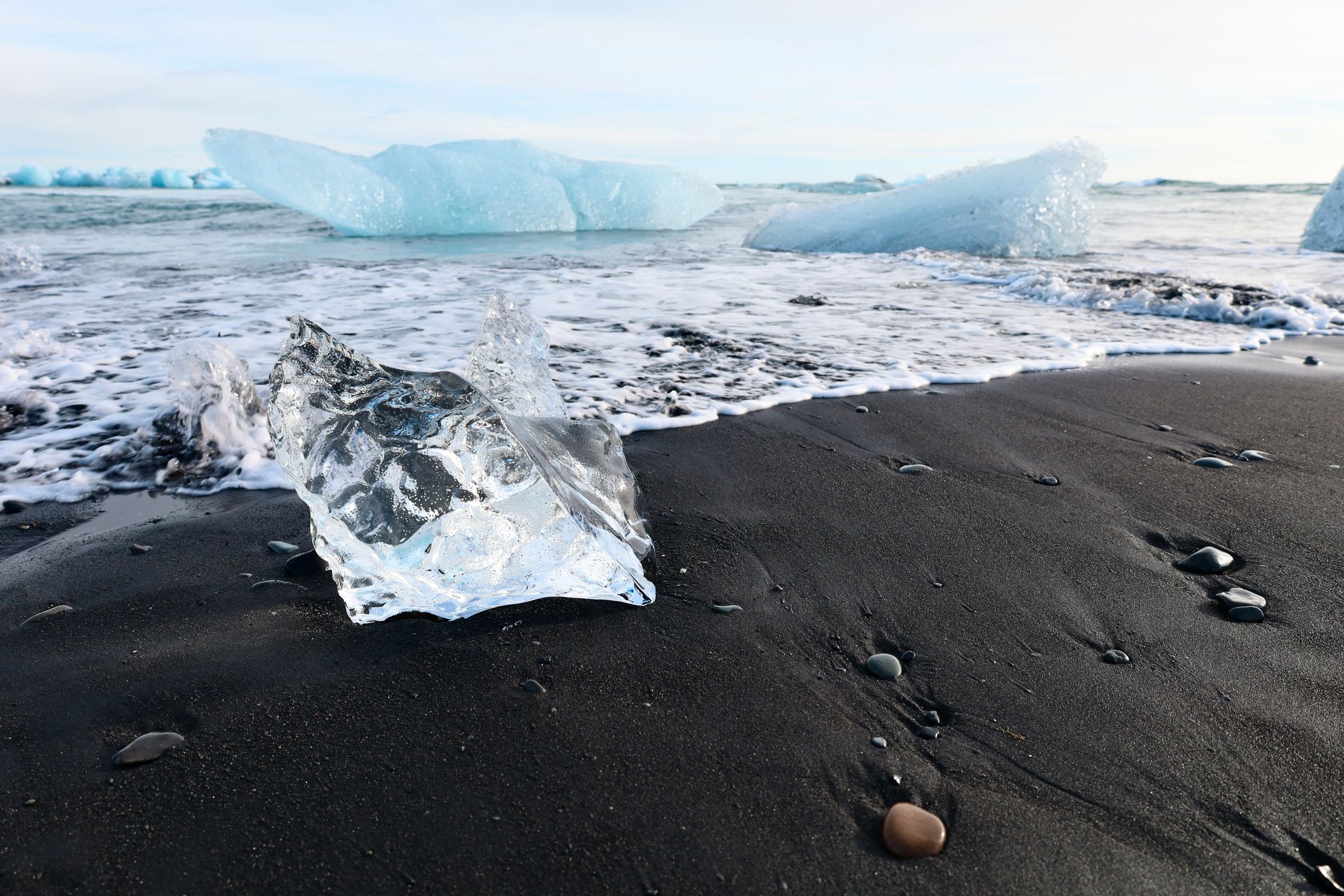 Glacier ice on the black sand of Diamond Beach