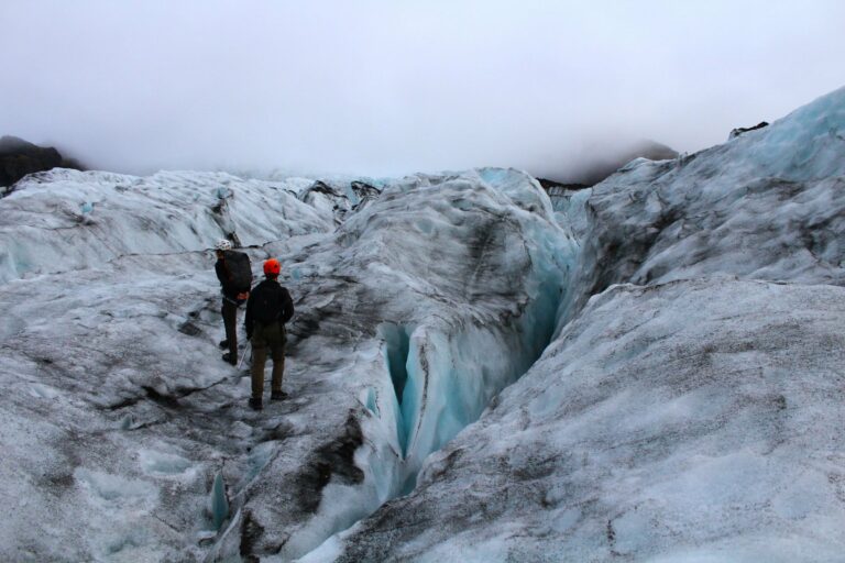 Walkers exploring a glacier in Iceland