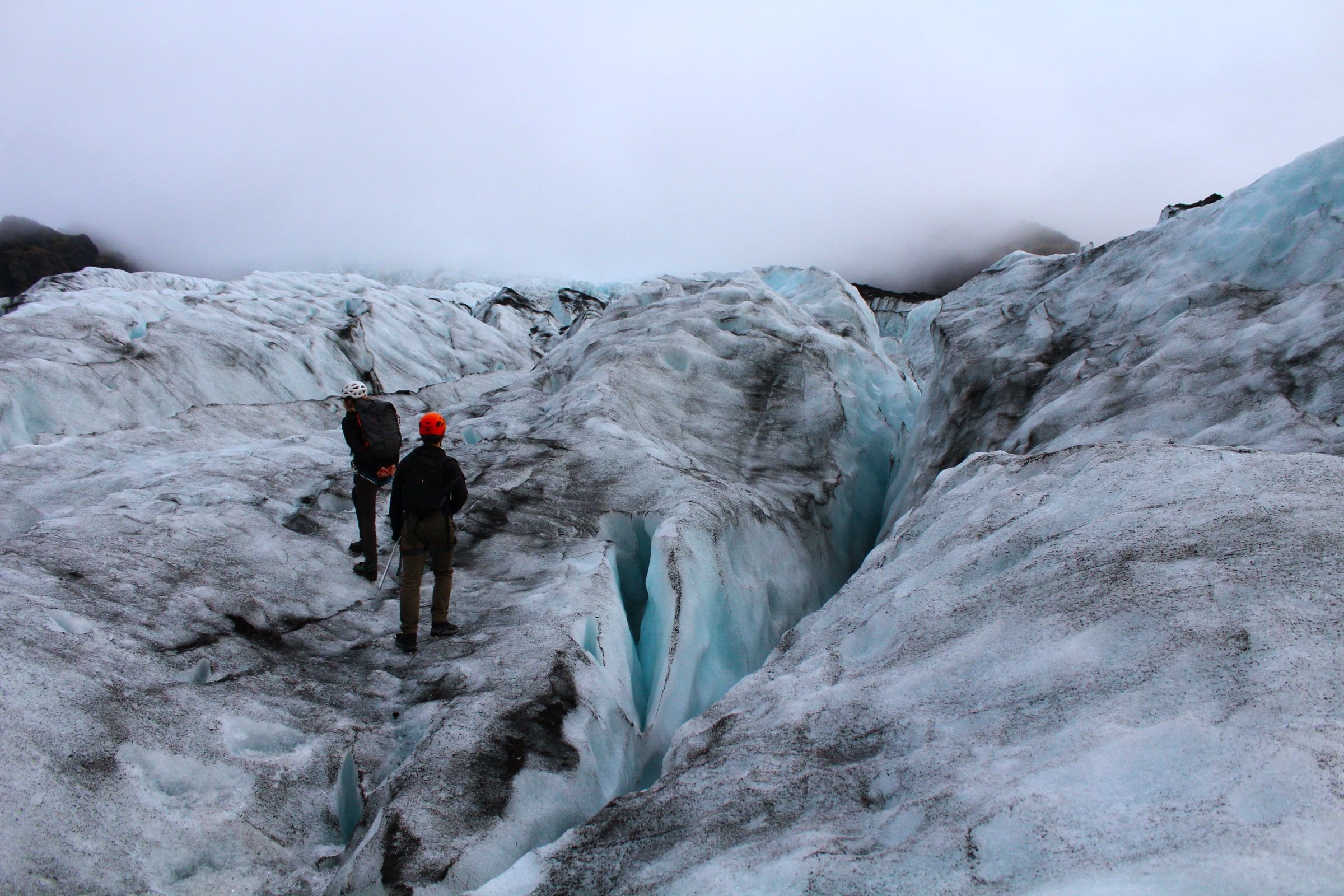 Walkers exploring a glacier in Iceland