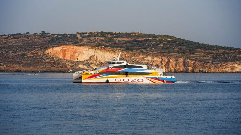 The Gozo ferry passing the cliffs of Malta