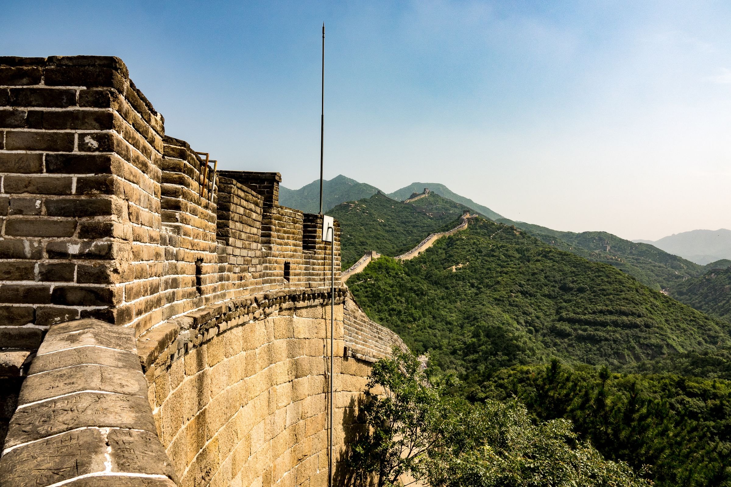 The Great Wall winding through green hills