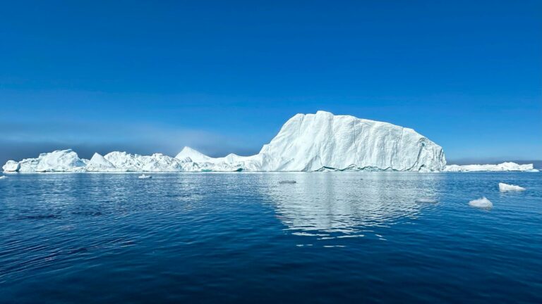 An iceberg in calm Greenland waters