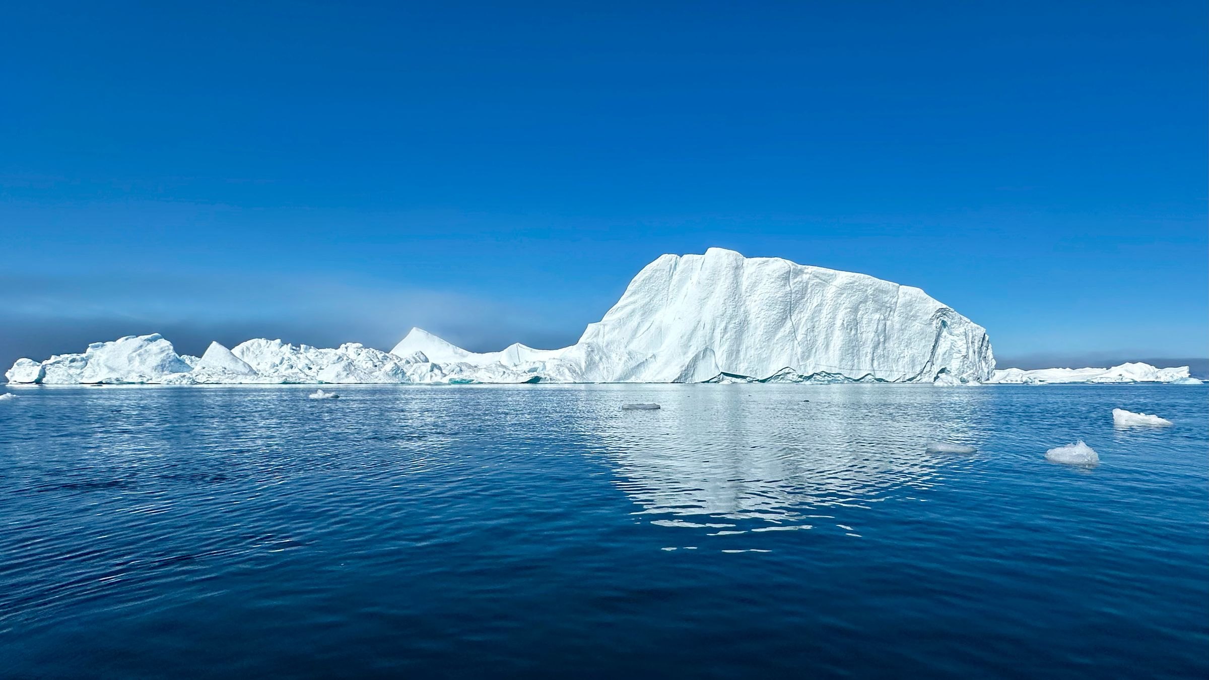 An iceberg in calm Greenland waters