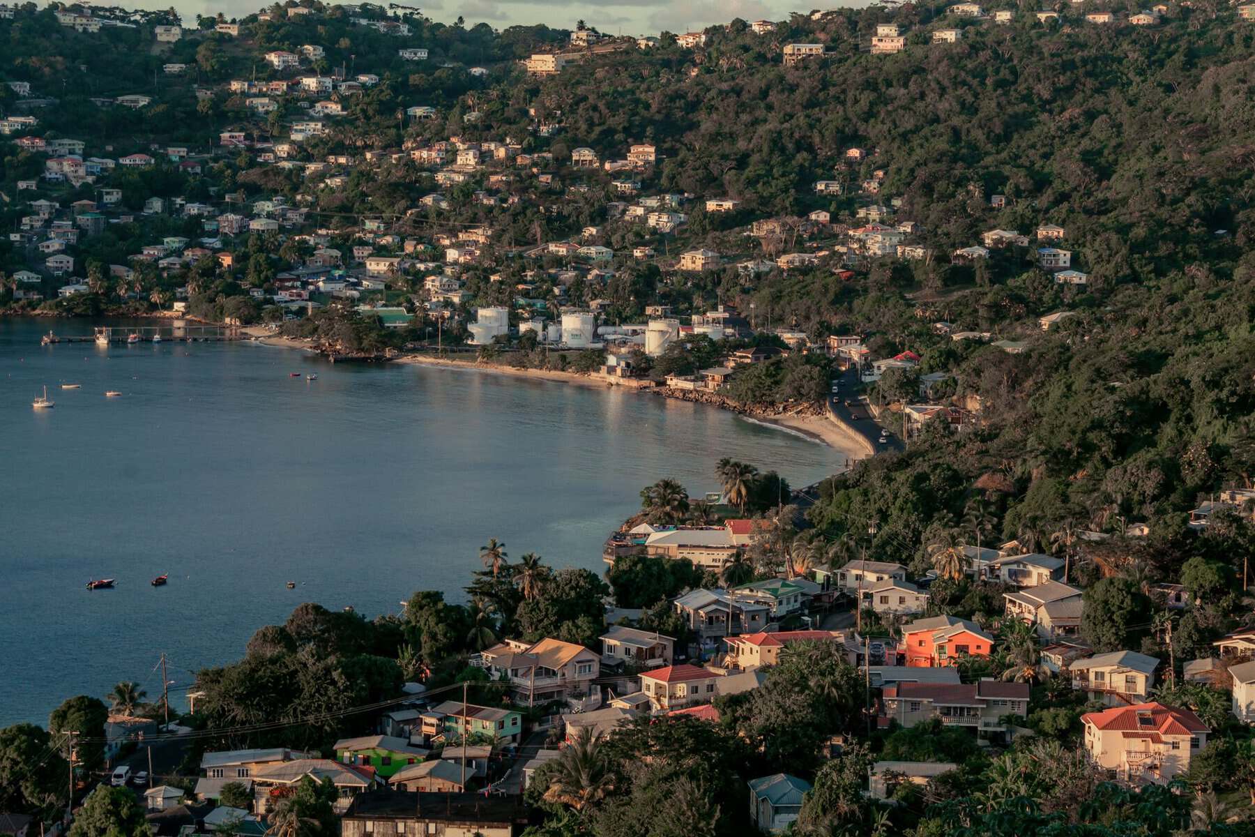 Aerial view of Grenada’s green coastline and colourful houses