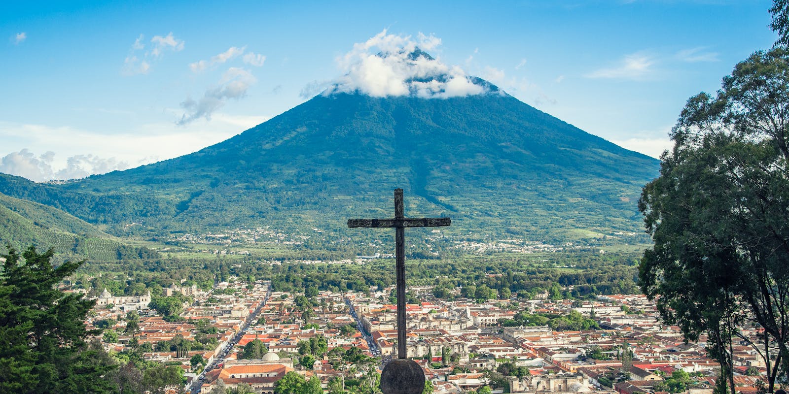 Antigua Guatemala cobbled streets with Volcano Agua backdrop