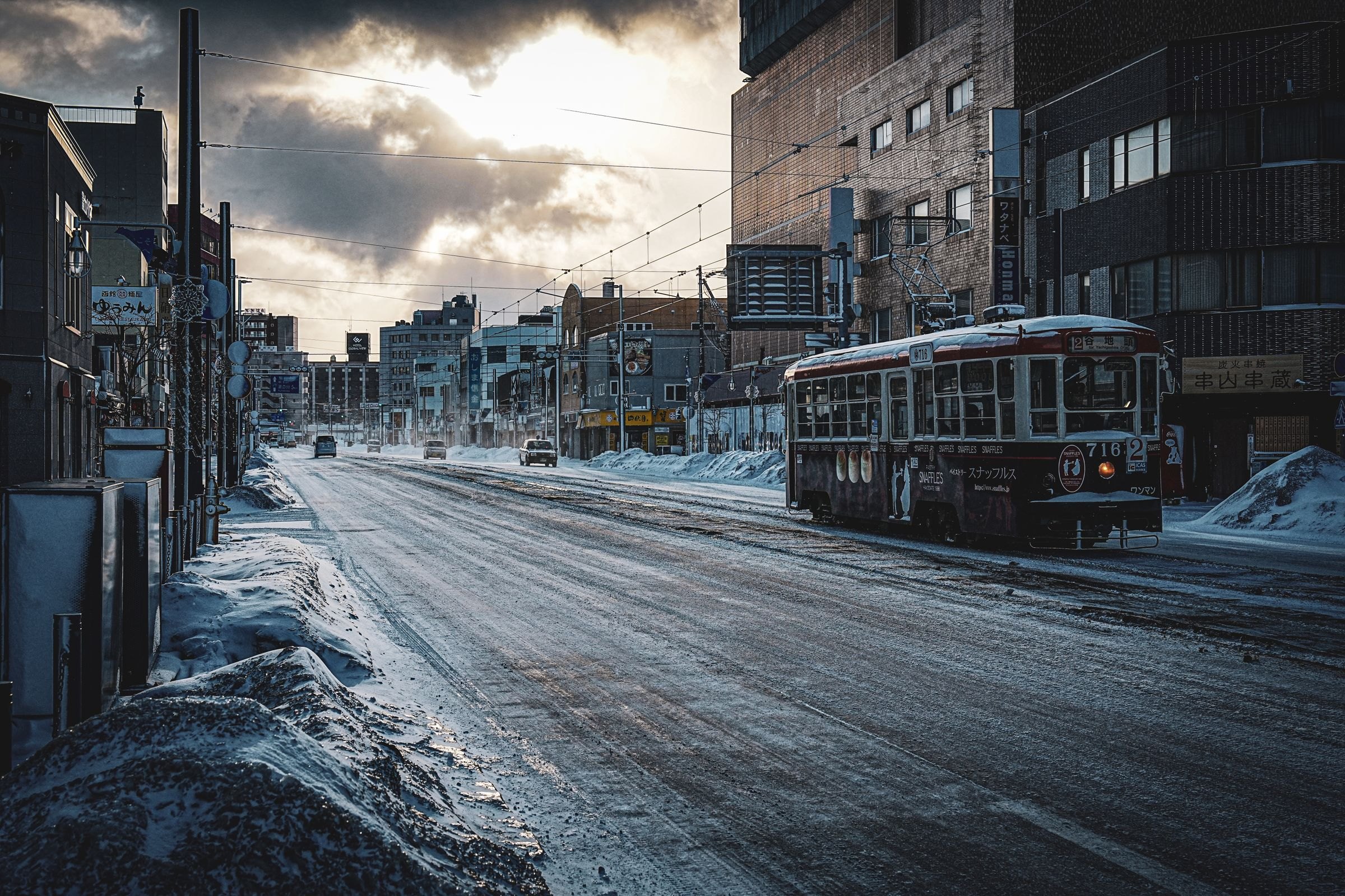 A tram on a snowy street in Hakodate