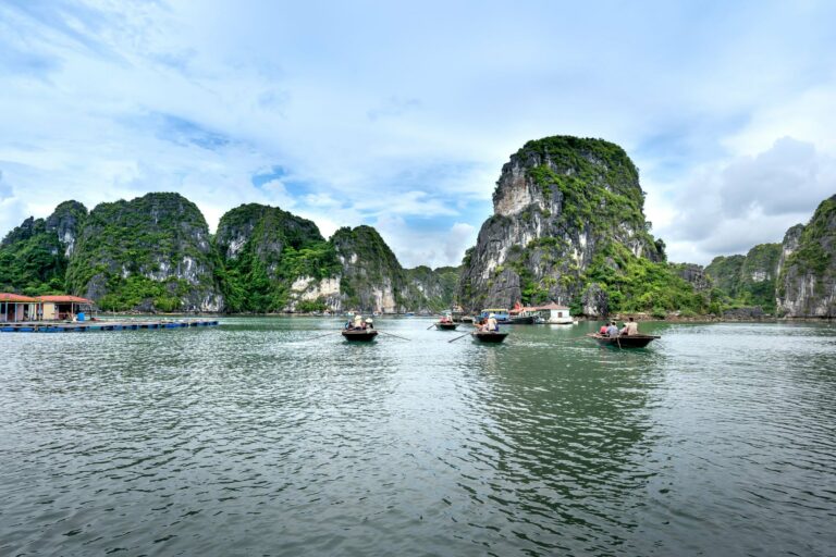 Boats among the karsts of Halong Bay
