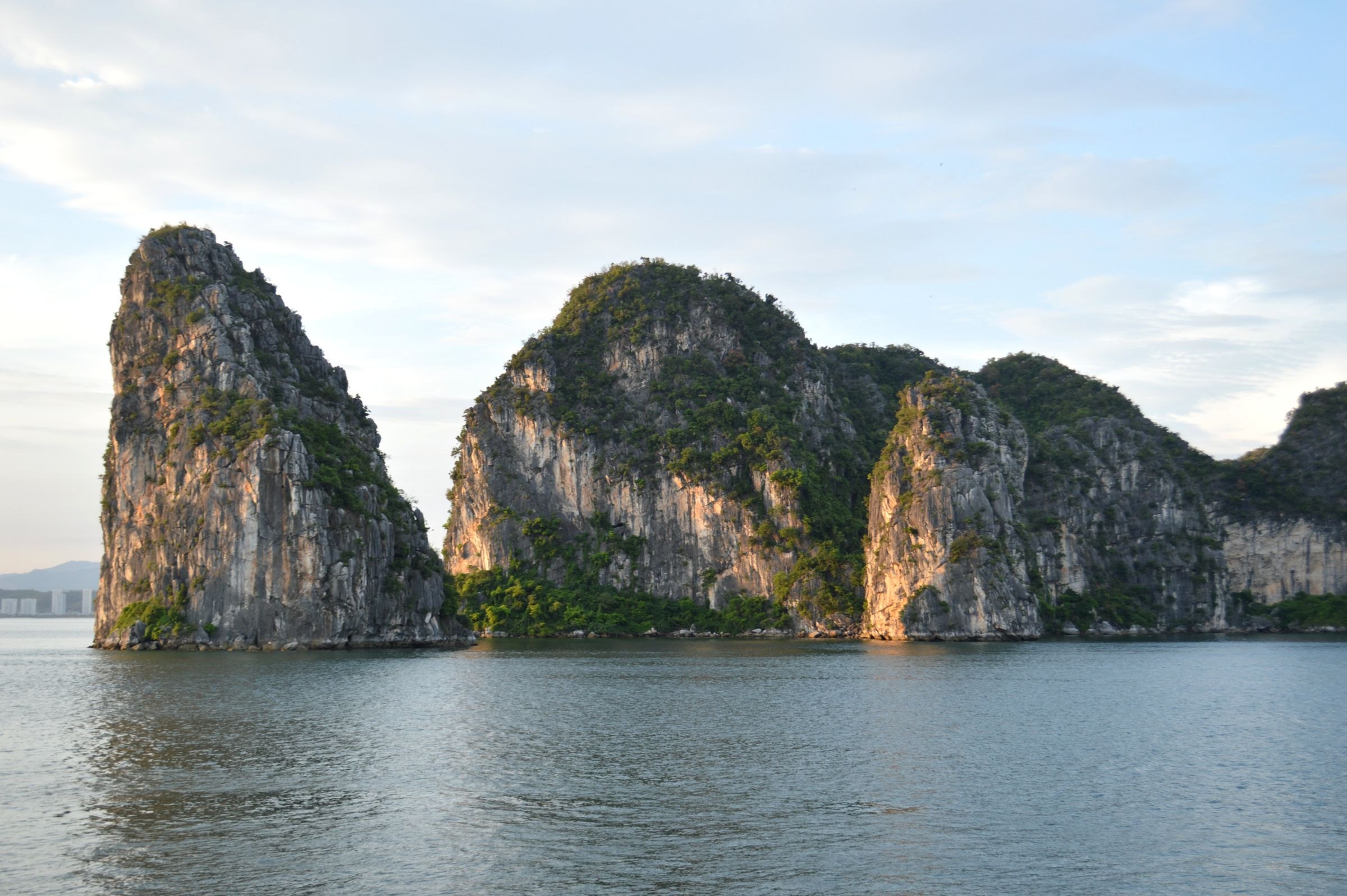 Limestone karsts reflected in Halong Bay