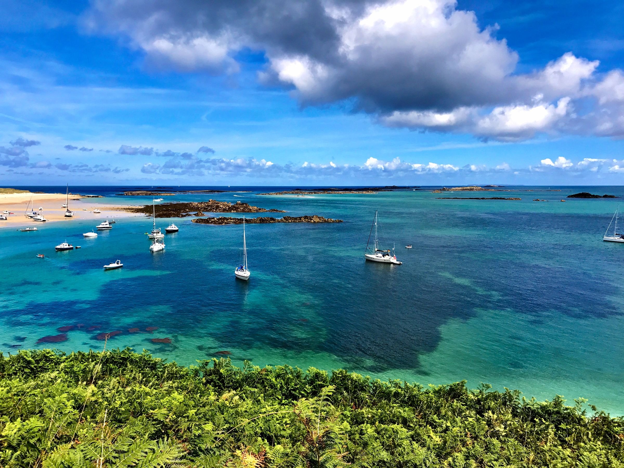 Sailboats in the clear water off Herm