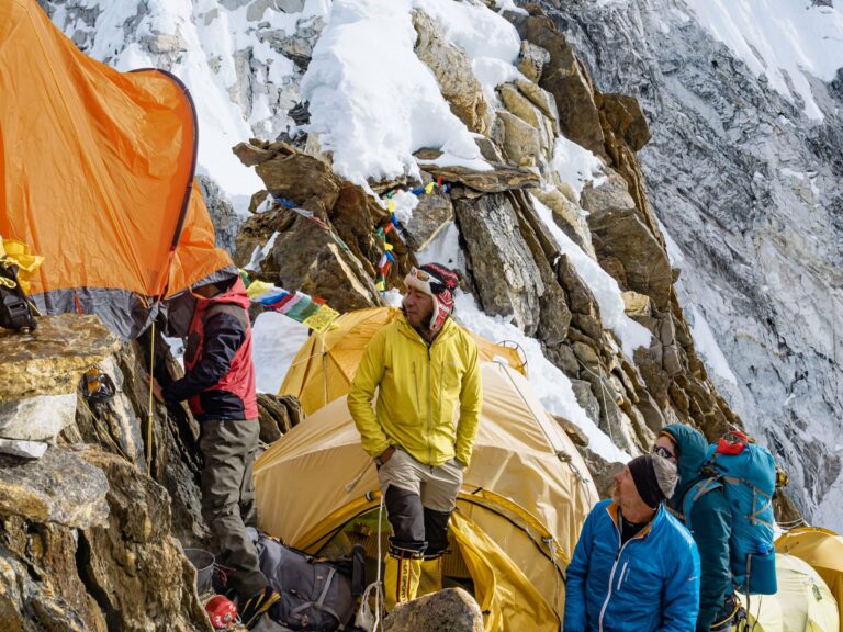 Climbers setting up tents at a Himalayan high camp