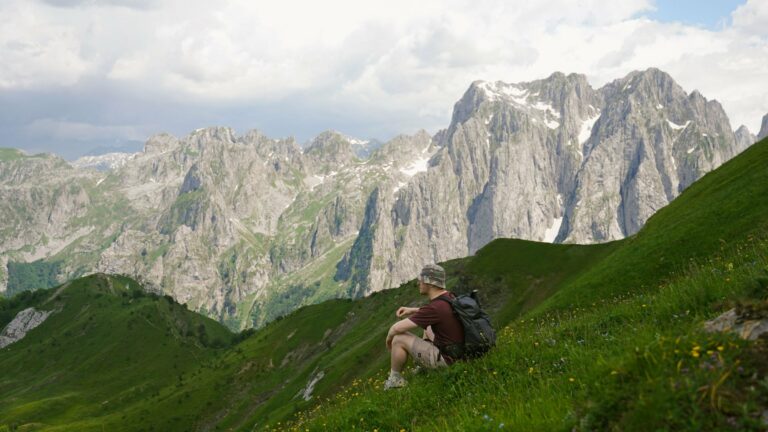 A hiker looking out over the Accursed Mountains