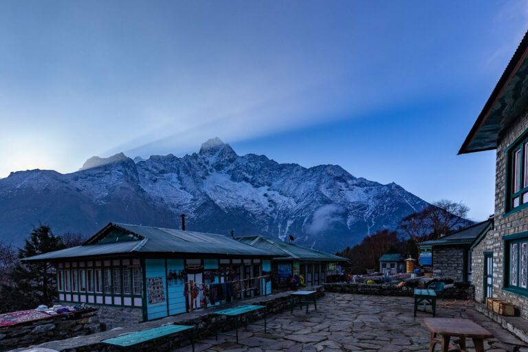 A trekking lodge below Himalayan peaks