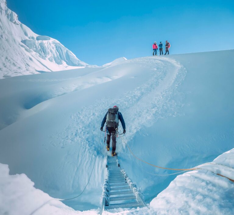 Climbers crossing a snowy ridge in the Everest region