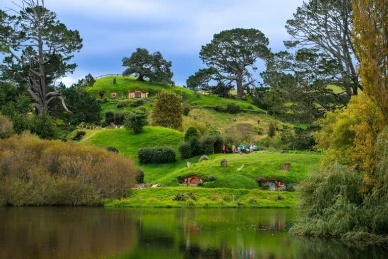 Hobbit holes in the green hills of Hobbiton, New Zealand