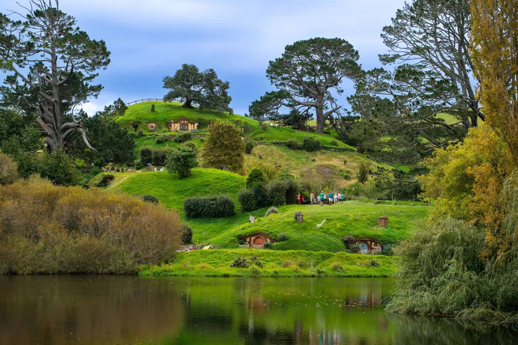 Hobbit holes in the green hills of Hobbiton, New Zealand