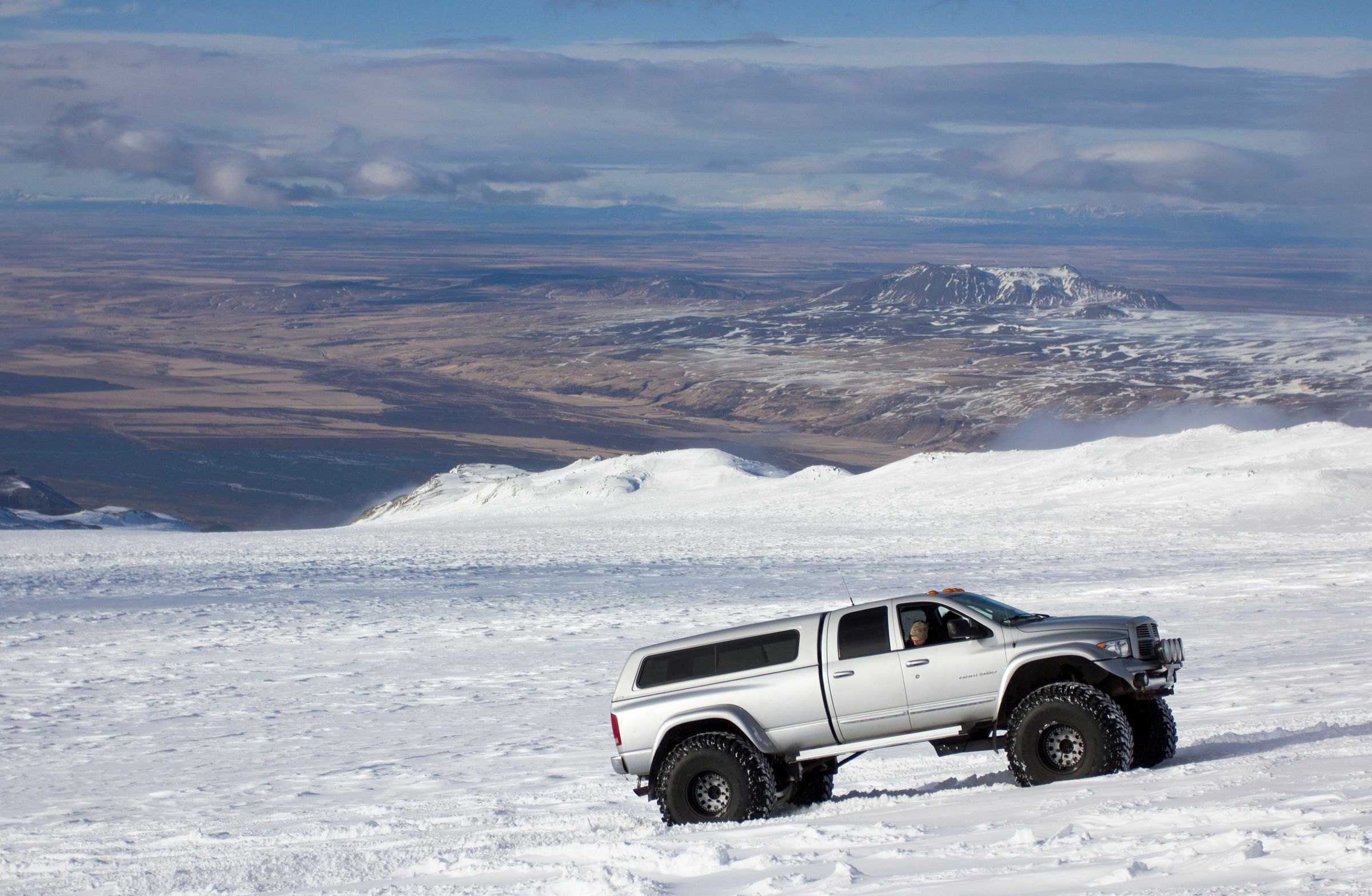 A super jeep crossing deep snow in Iceland