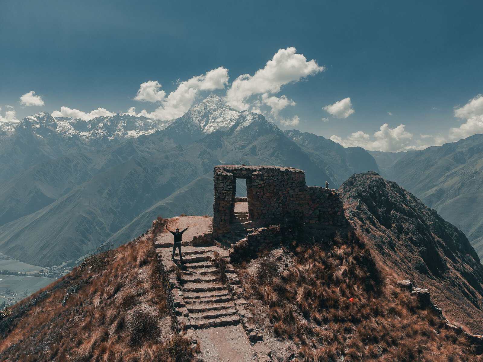 A hiker at Intipunku, the Sun Gate, above the Sacred Valley