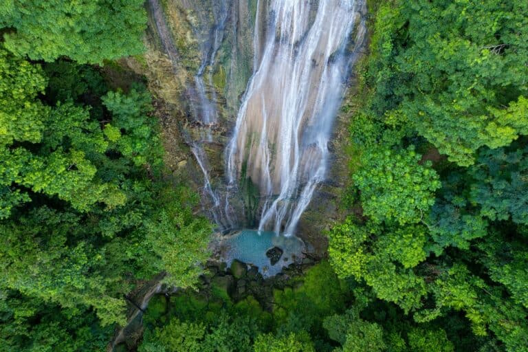A waterfall in the Jamaican rainforest from above