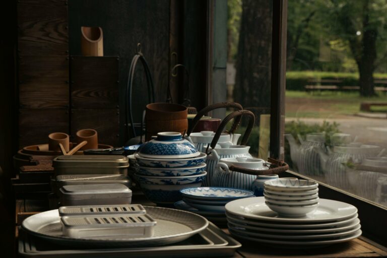 Japanese ceramic dishware arranged by a window