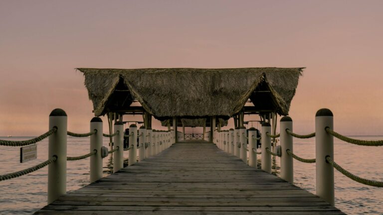 A thatched jetty at sunset in Guatemala