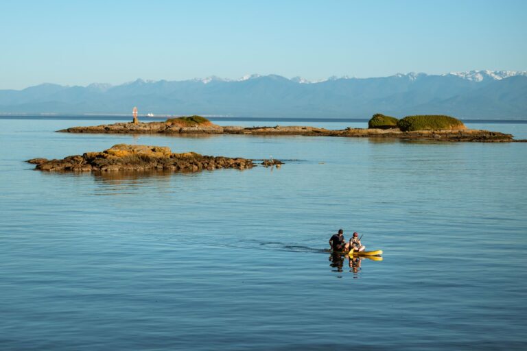 Kayakers near rocky islands in British Columbia