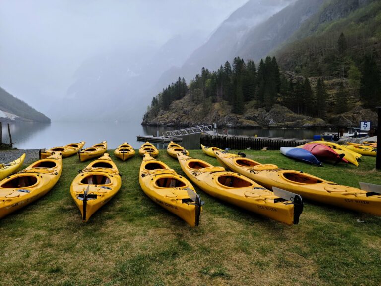 Yellow kayaks on the shore of a Norwegian fjord