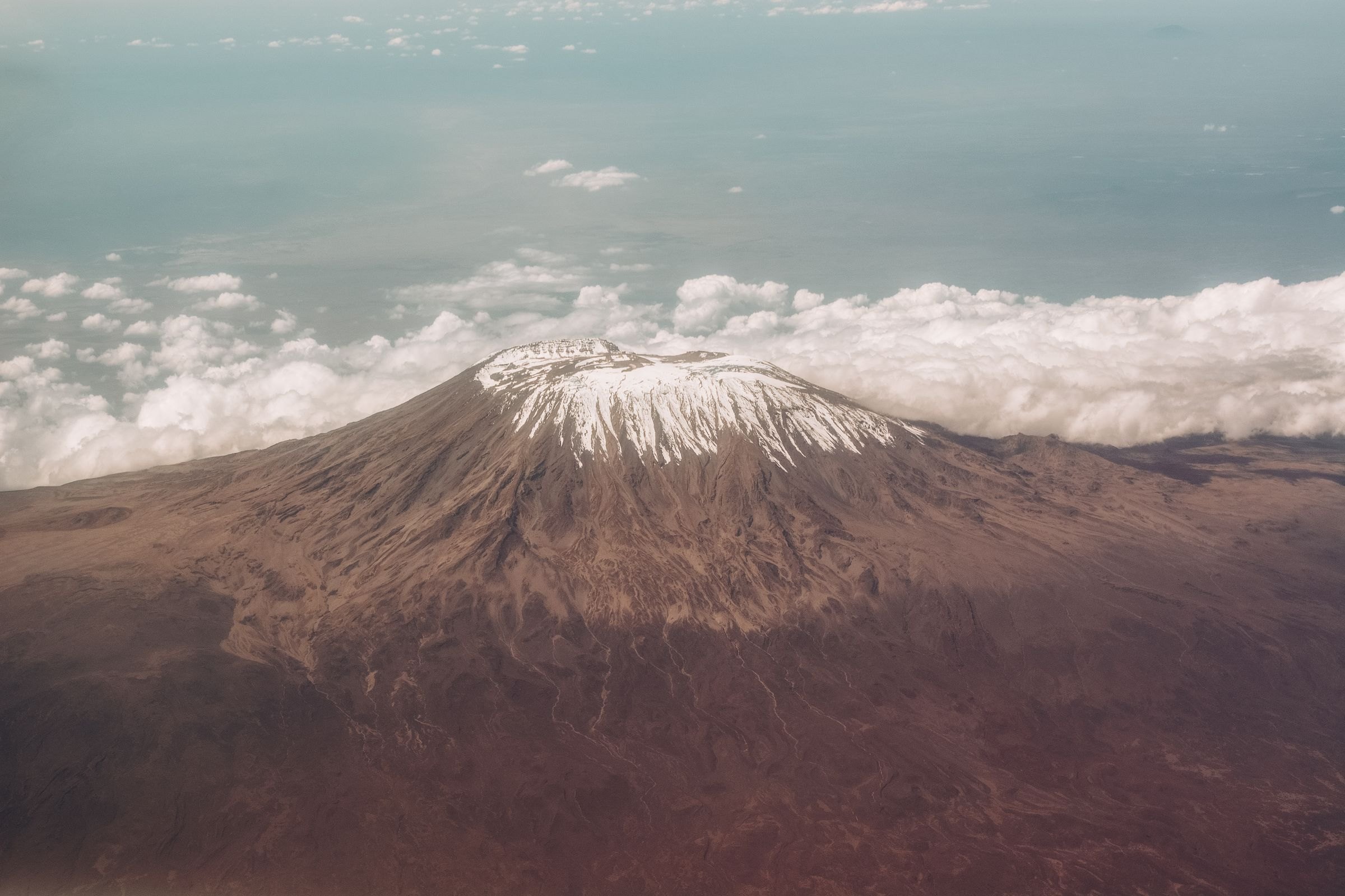 Kilimanjaro's snow-capped crater from the air