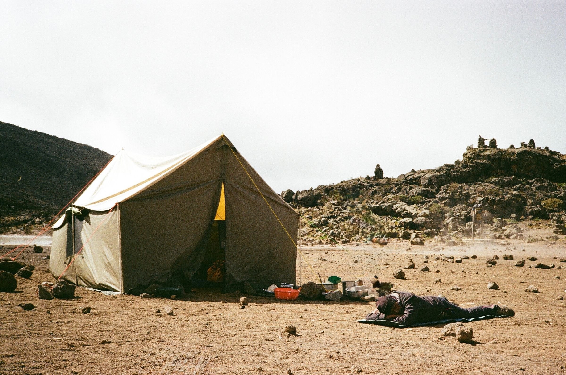 A tent pitched on the rocky slopes of Kilimanjaro