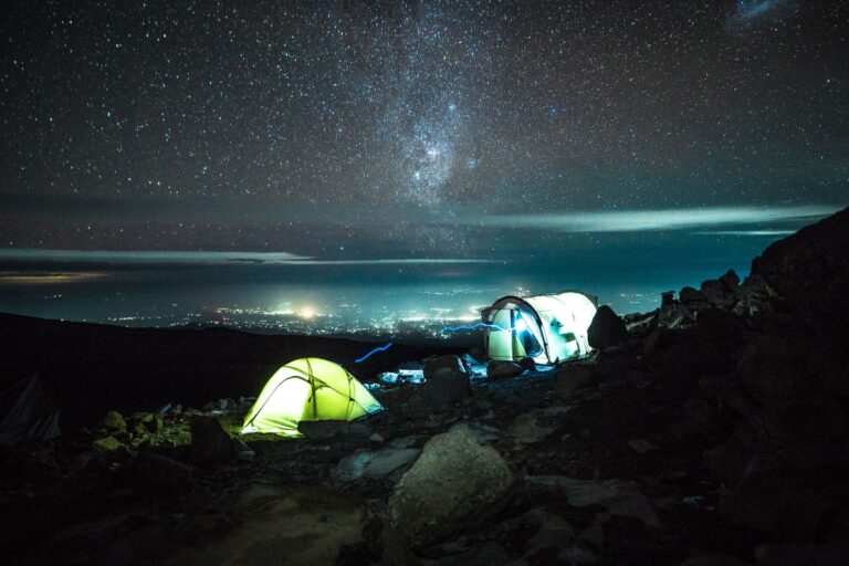 Tents lit up under the stars on Kilimanjaro