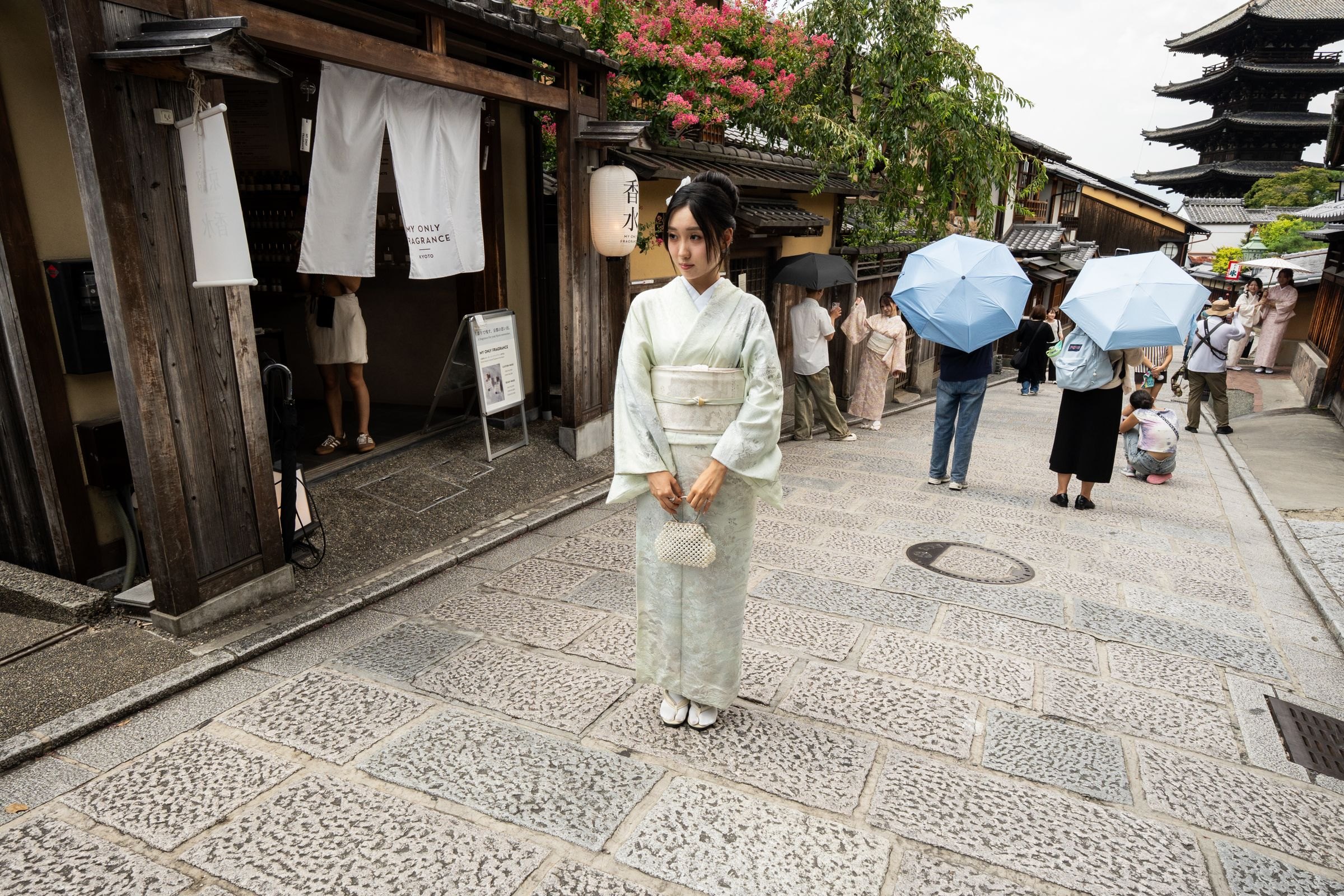 A traditional Kyoto street with a pagoda