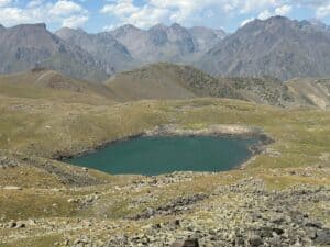 An alpine lake among rugged mountains in Kyrgyzstan