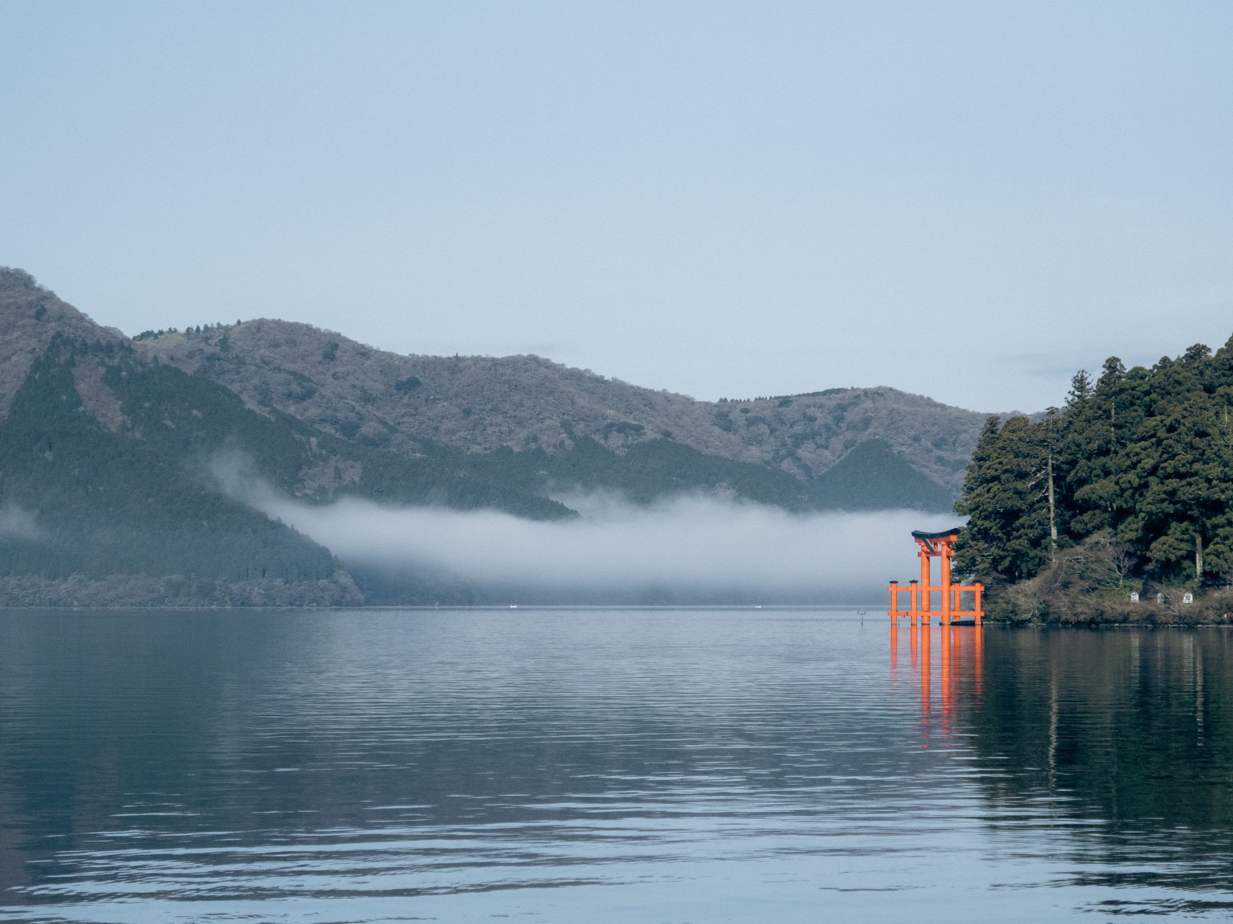 The torii gate on Lake Ashi in morning mist
