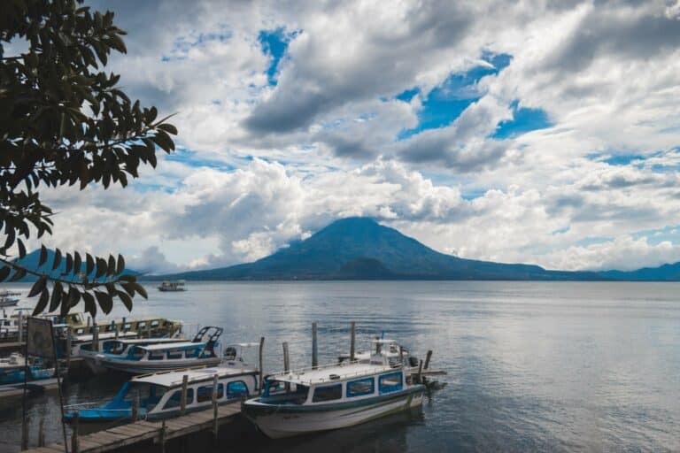 Boats on Lake Atitlán with a volcano behind, Guatemala