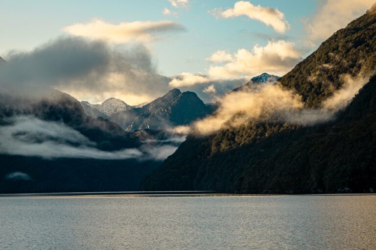 Lake Manapouri at sunrise with misty mountains