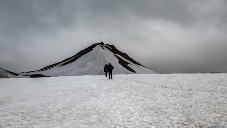Hikers crossing snowfields on the Laugavegur Trail