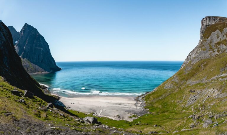 A white-sand beach between cliffs in the Lofoten Islands