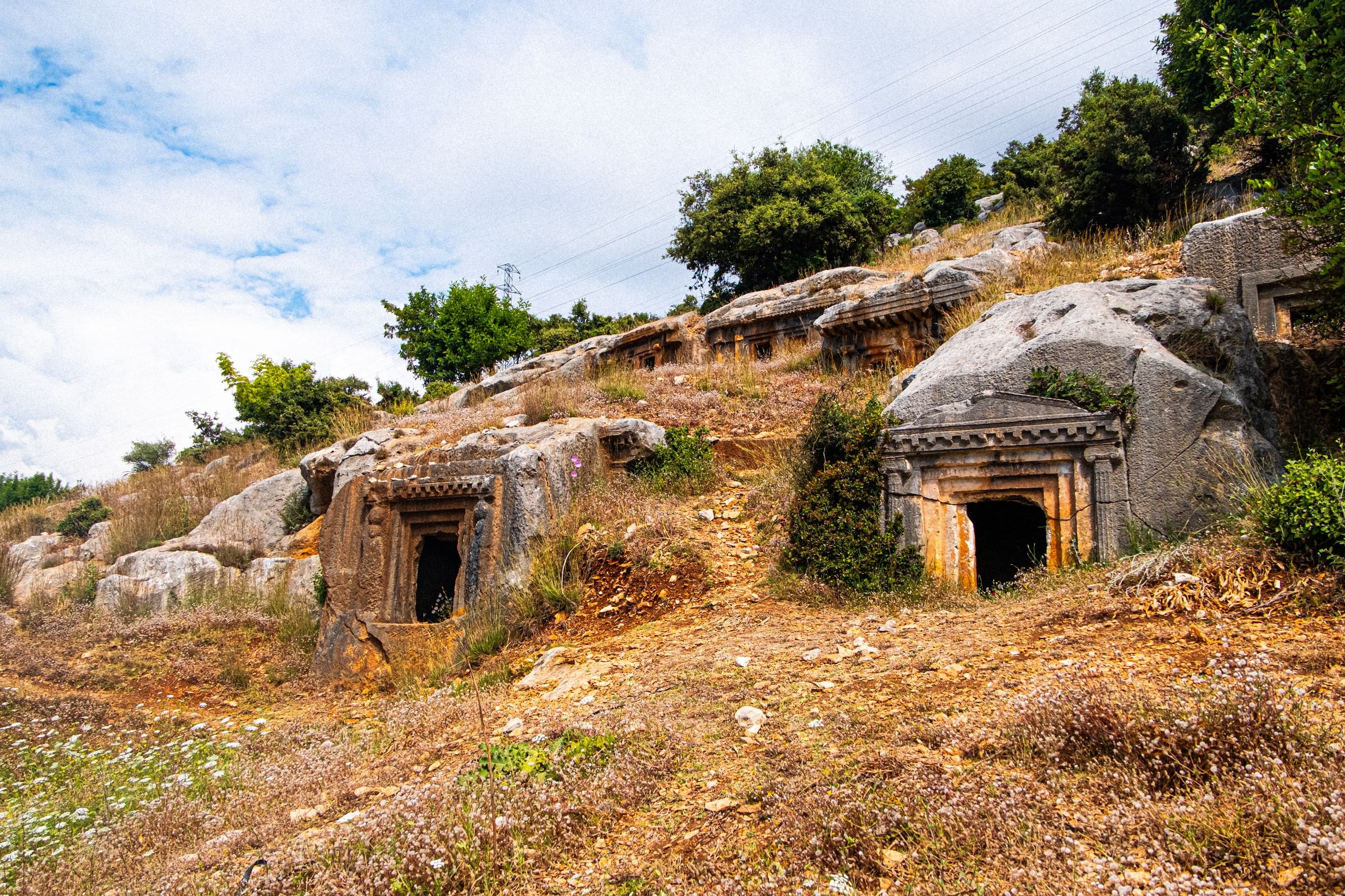 Rock-cut tombs on a hillside on the Lycian coast