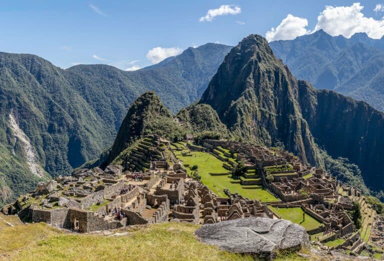 Machu Picchu surrounded by green mountains