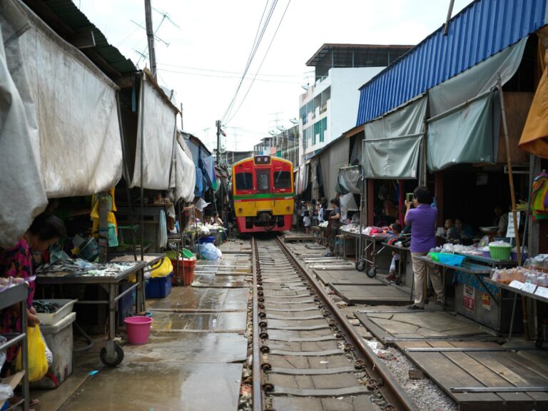 A train passing through Maeklong railway market