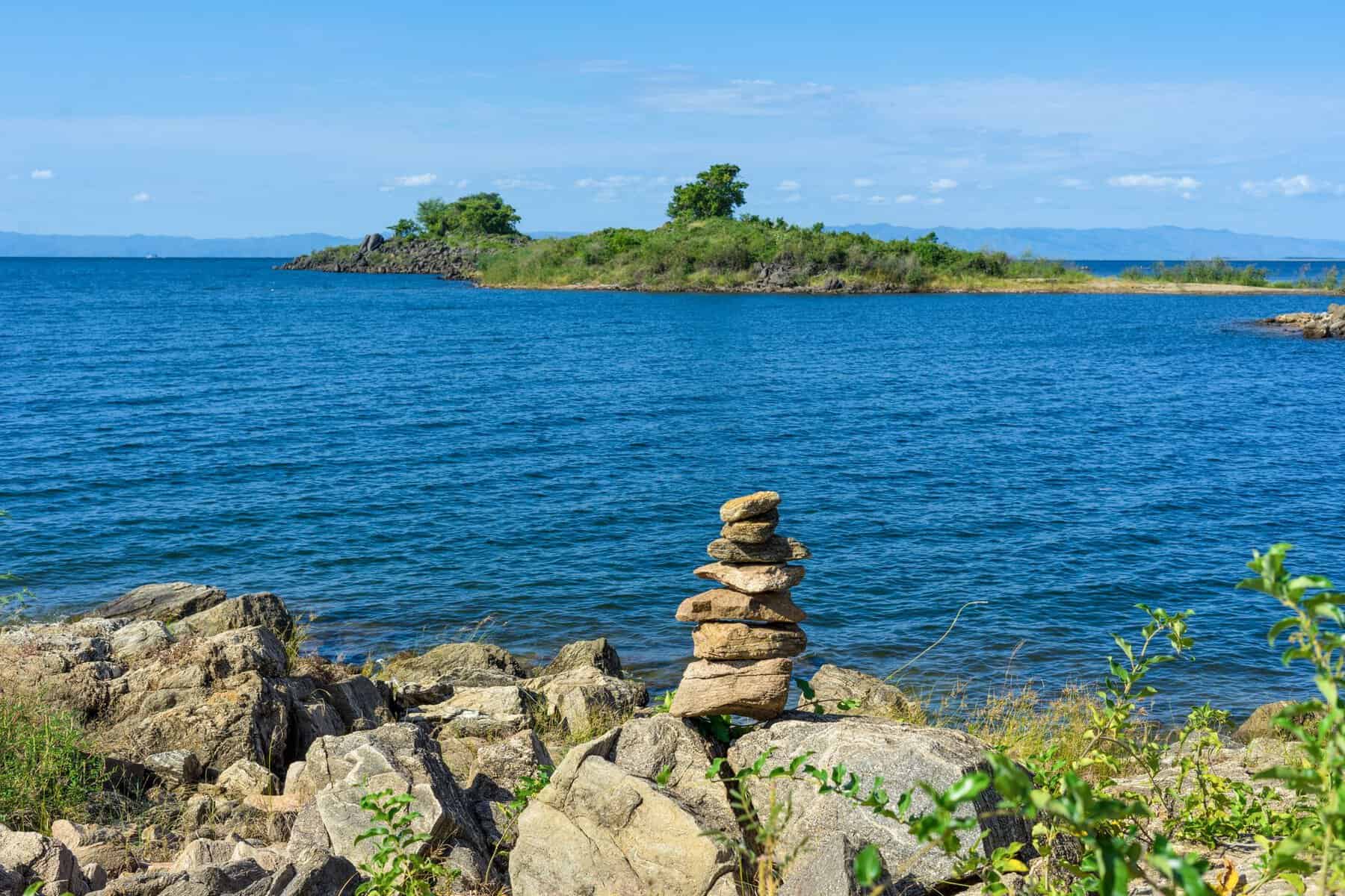 A rocky lake shore and island in Malawi