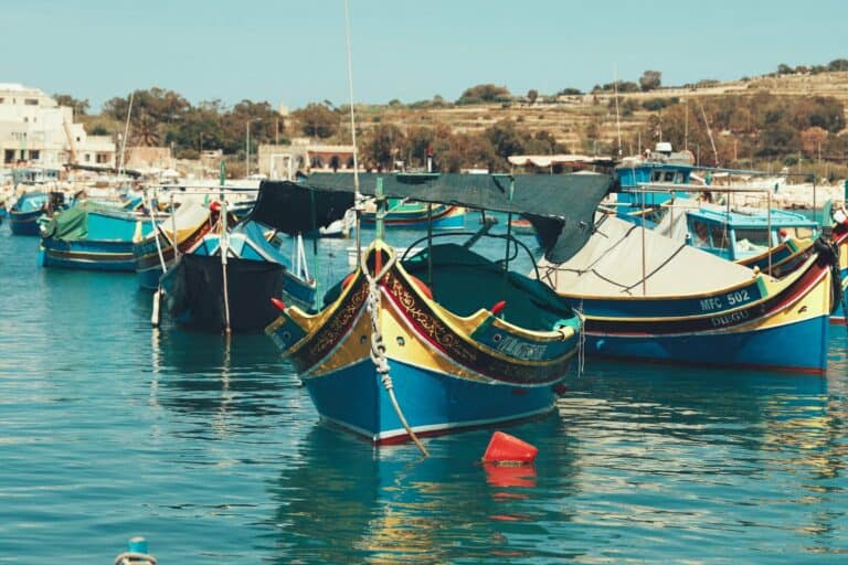 Painted luzzu fishing boats in Marsaxlokk harbour, Malta