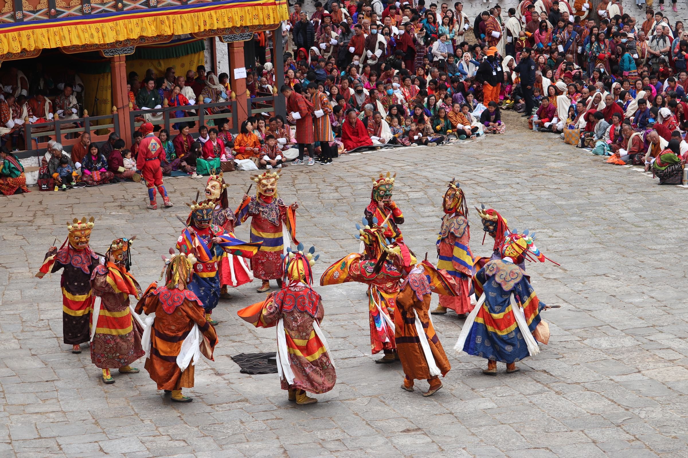 Masked dancers at a Bhutanese festival
