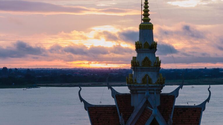 A temple silhouette by the Mekong in Phnom Penh
