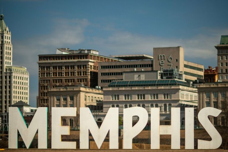 The Memphis sign against the city skyline