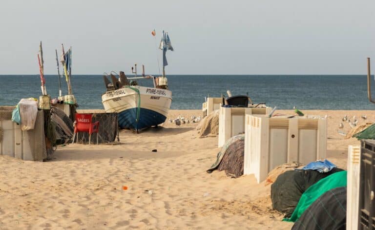Fishing boats on the sand at Monte Gordo beach, Algarve, Portugal
